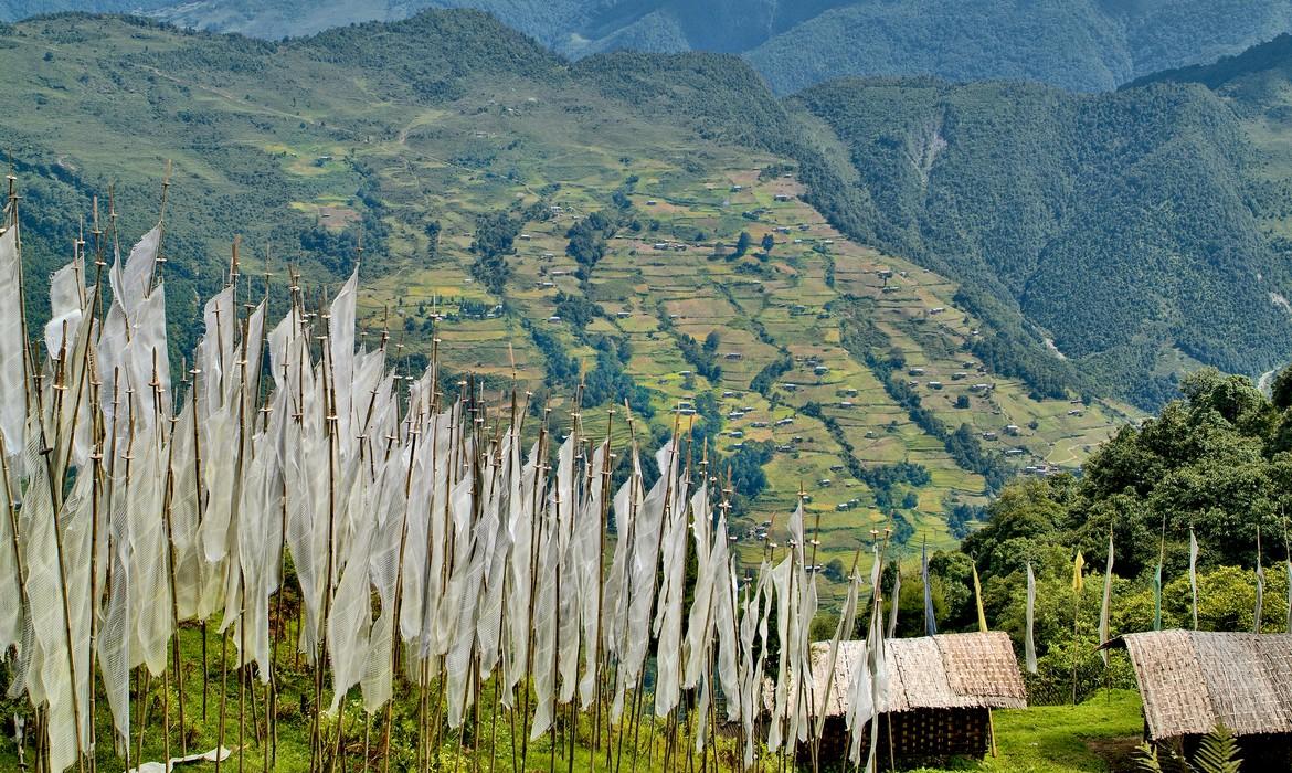Prayer flags and landscape around mountain village, Trashigang