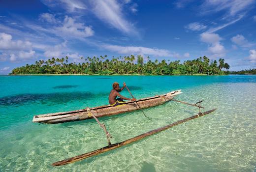 Boy in outrigger, Papua New Guinea