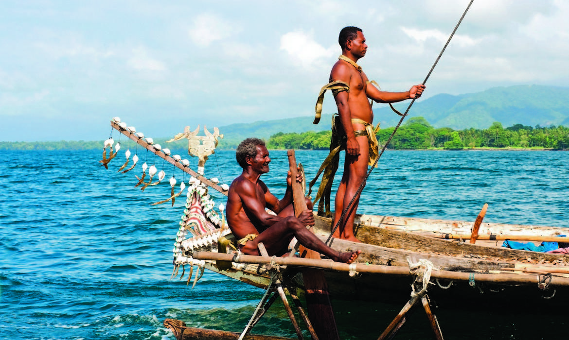 Sailing a traditional boat at the Milne Bay Canoe Festival, Milne Bay
