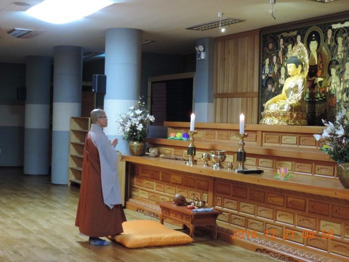 Learning Buddhist practices with head monk
