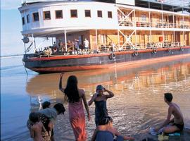 Villagers watch a Pandaw Cruise pass by
