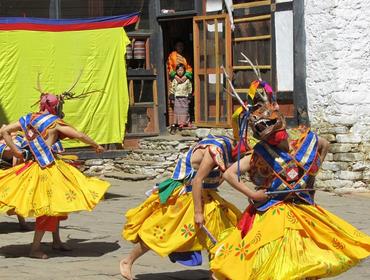 Masked dancers, Bumthang