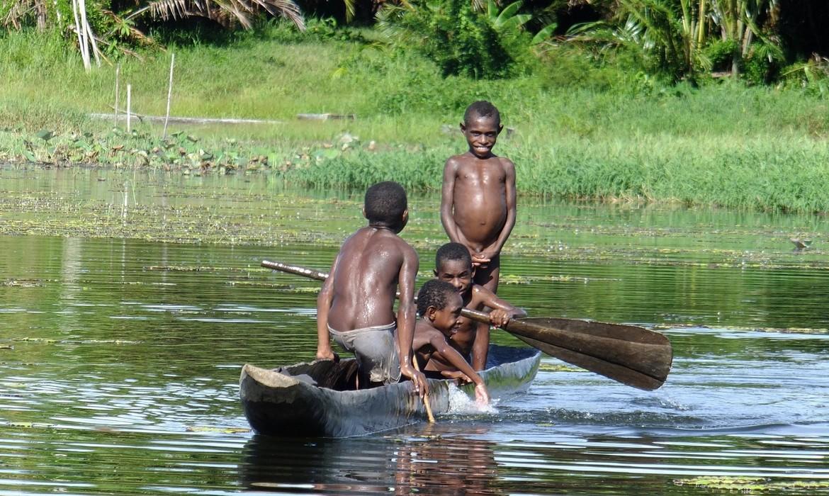 Boys with canoe, Lake Murray