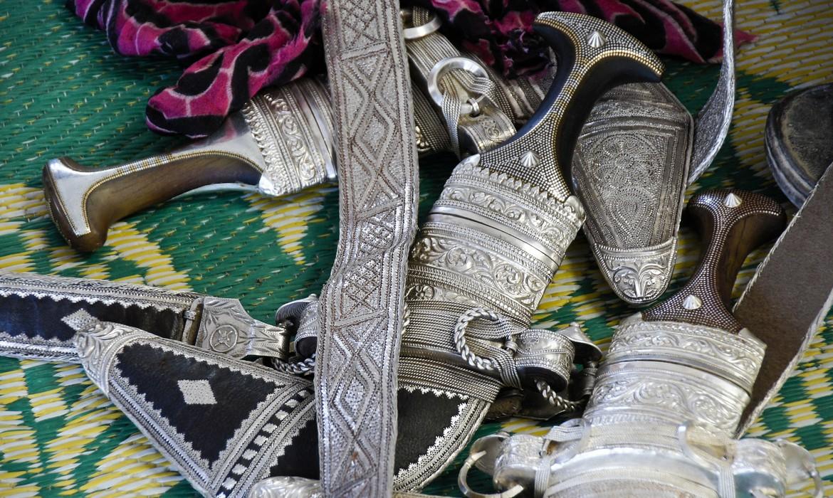 Engraved silver belts and khanjars daggers for sale in market, Sinaw
