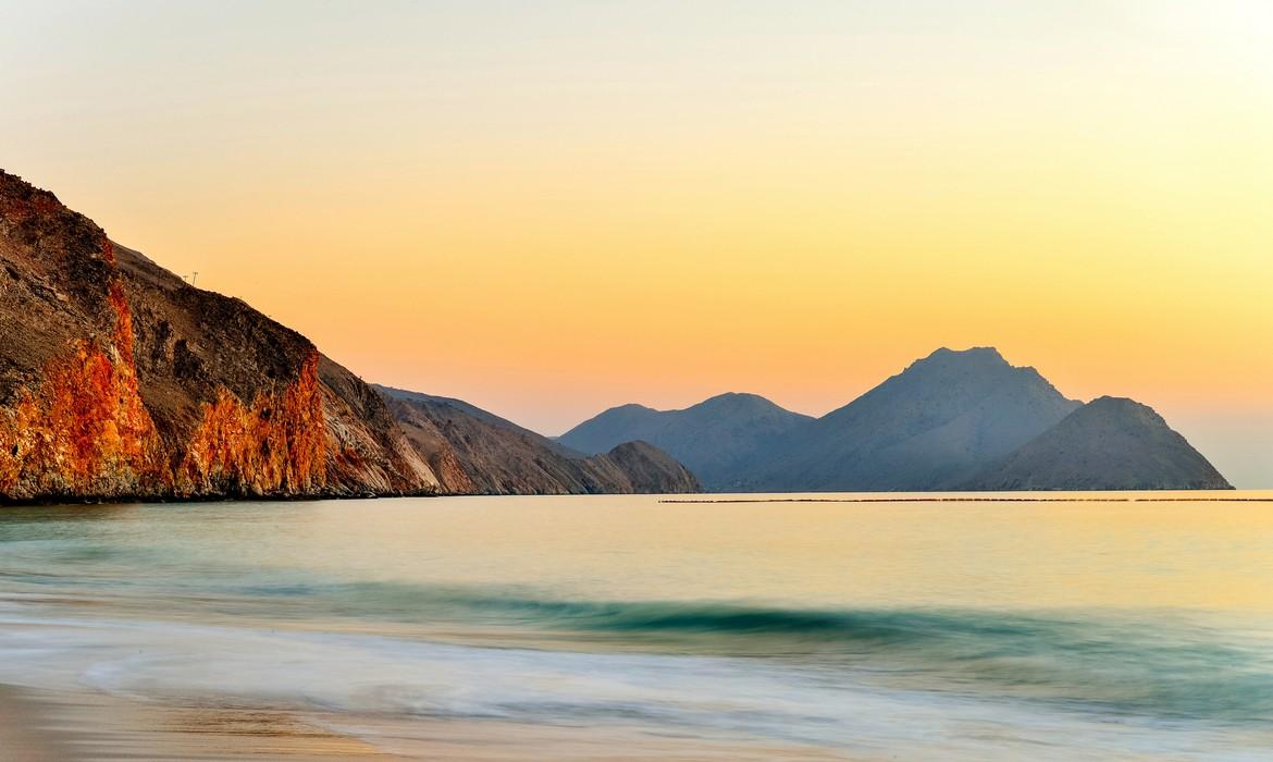 Scenic view of sunrise over Zighy Bay