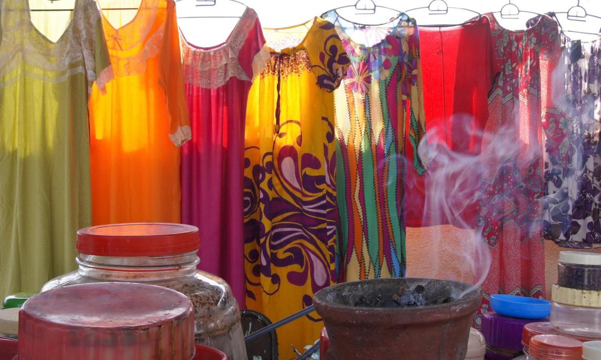 Colorful gowns displayed for sale at the Wednesday women`s market