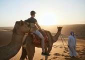 Camel riding in the desert